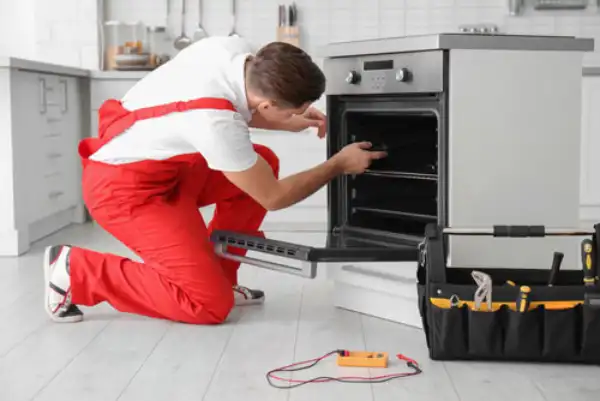 Our technician is fixing oven